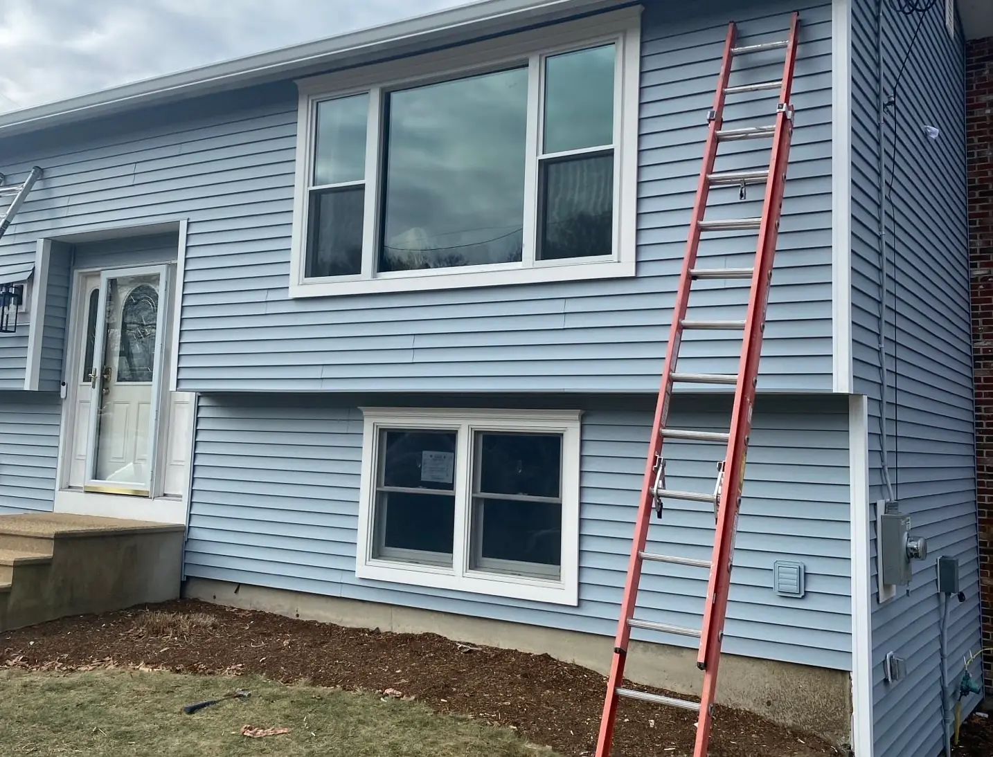 Vinyl Siding, completed Sustainable Decks project